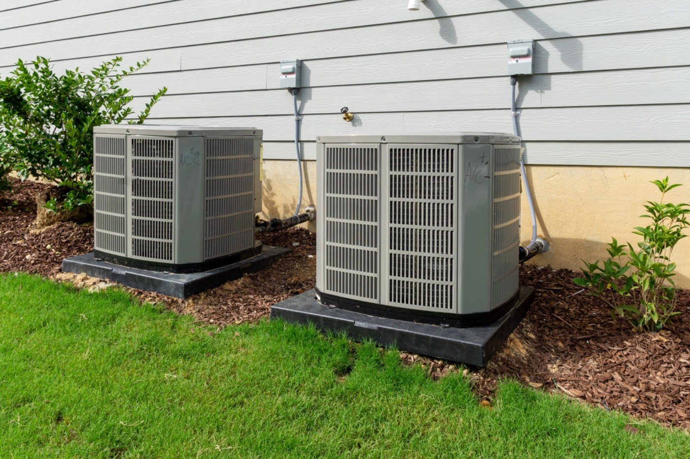 Residential air conditioning condenser units serviced by Hixon near Grayson, GA
